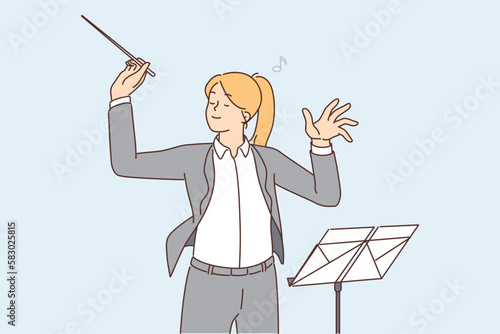 Female conductor leading orchestra 