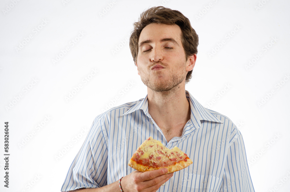 A man enjoys eating pizza. Isolated white background for text space A man enjoys eating pizza. Isolated white background for text space