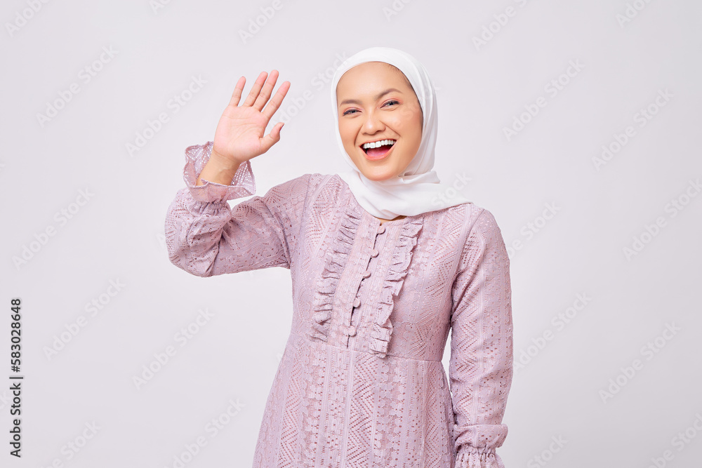 Portrait of smiling beautiful young Asian Muslim woman wearing hijab ...