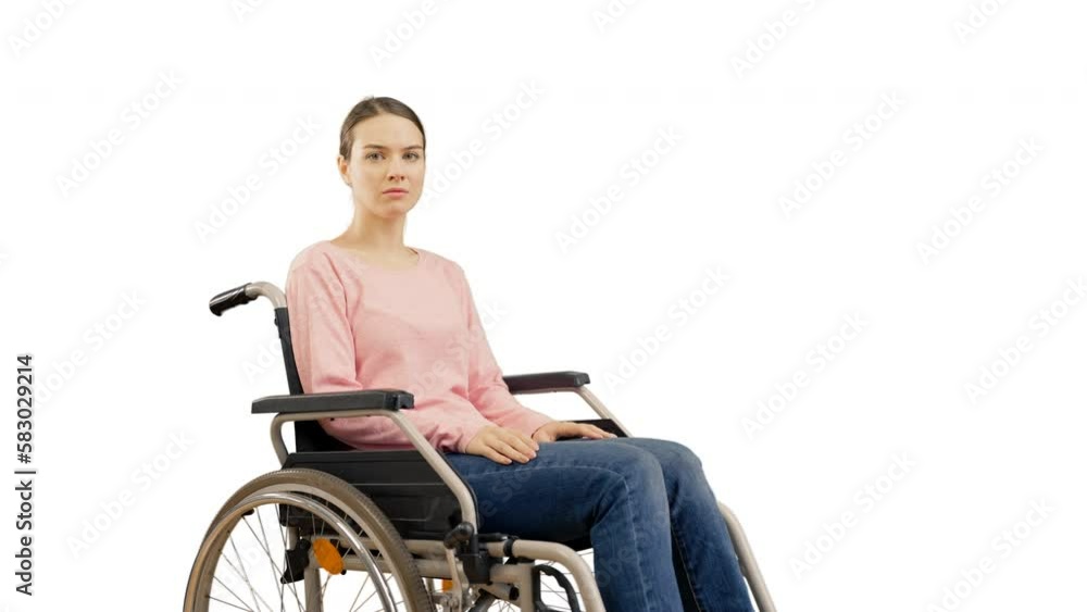 Portrait of serious woman with disability on white background, wheelchair user Portrait of serious woman with disability on white background, wheelchair user