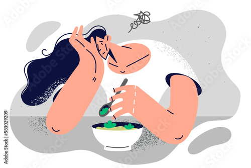 Sad woman suffering from lack of appetite of unpalatable wholesome food recommended for diet