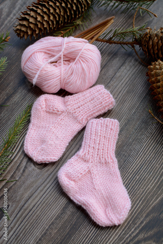 Small and soft baby socks made of pink cotton yarn 