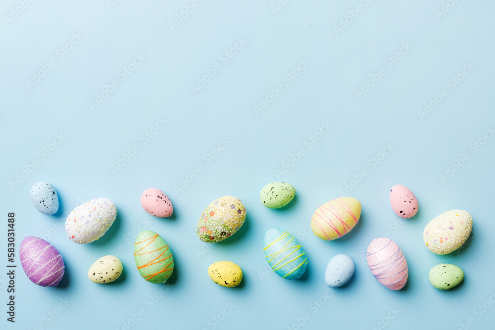 Happy Easter concept. Preparation for holiday. Easter eggs on colored background. flat lay top view copy space banner Happy Easter concept. Preparation for holiday. Easter eggs on colored background. flat lay top view copy space banner