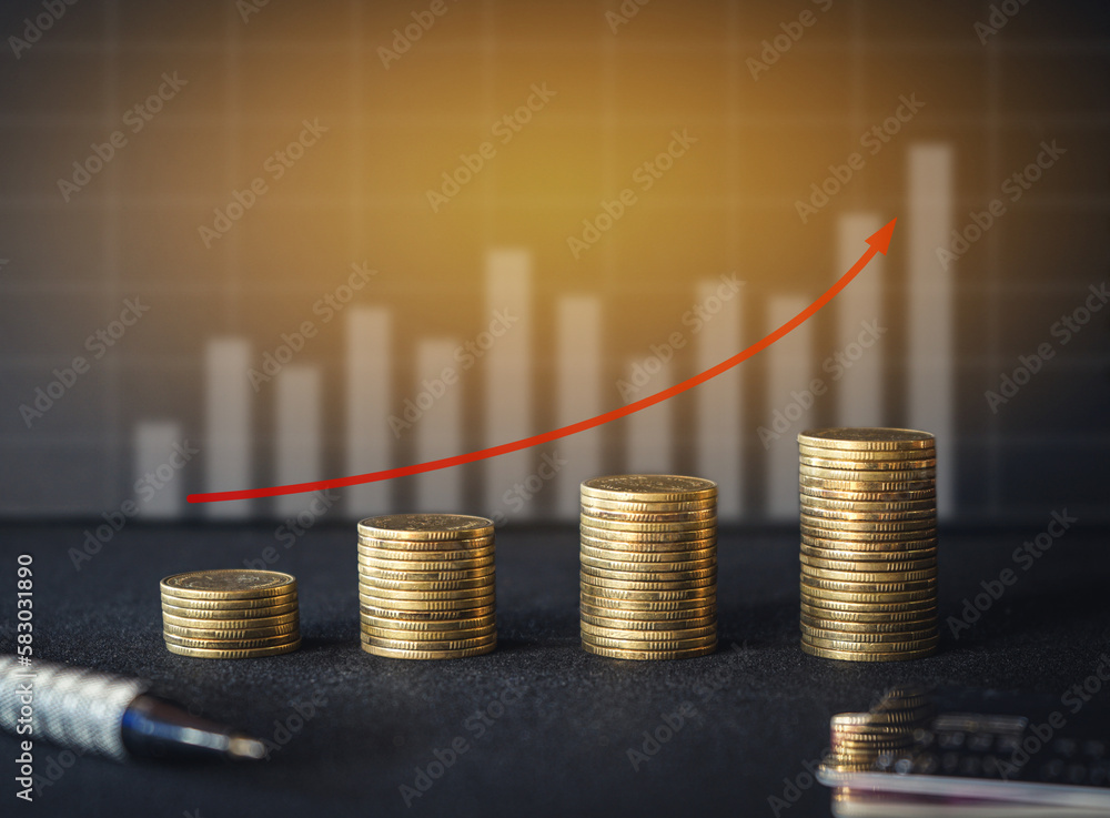 Stack of money coin on black background with curve up red arrow and graph. Business and financial concept. Stack of money coin on black background with curve up red arrow and graph. Business and financial concept.