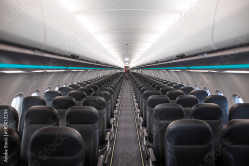 Commercial passenger aircraft interior with empty seats