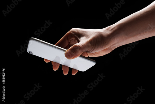 someone is making a payment with their phone On a black background