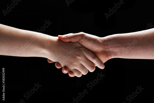 two people's hands are making a handshake gesture
