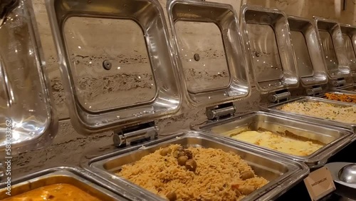 Hot and spicy Indian curries, rice, dhal, bread and other dishes ready for buffet dining
