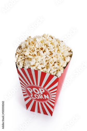 Popcorn in red and white striped cardboard bucket isolated on white background