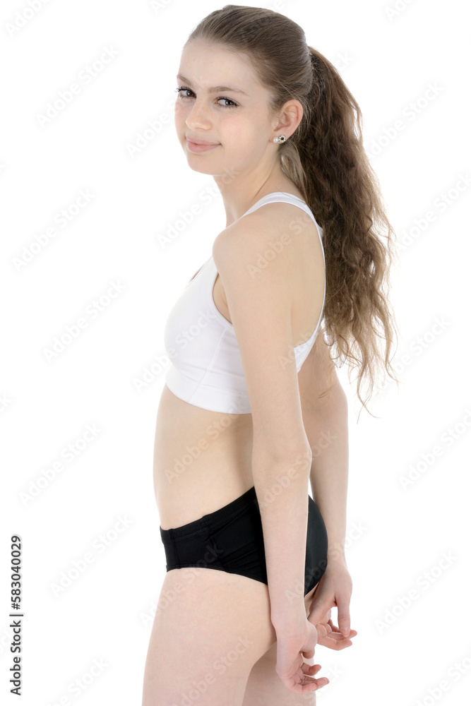 Beautiful sporty teenage girl posing in sportswear in studio, isolated on white Beautiful sporty teenage girl posing in sportswear in studio, isolated on white