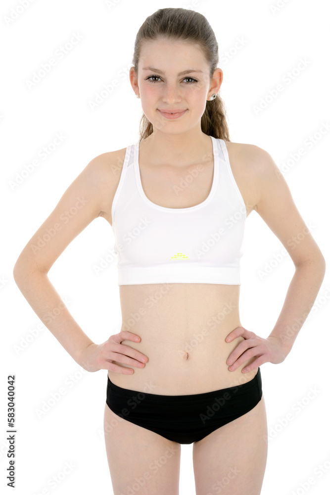 Sporty teenage girl posing in sportswear in studio, isolated on white Sporty teenage girl posing in sportswear in studio, isolated on white