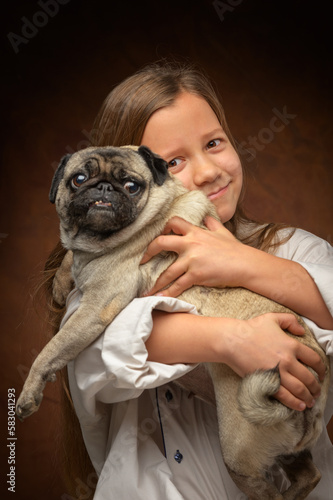 portrait of a girl with a pug on a dark background 1