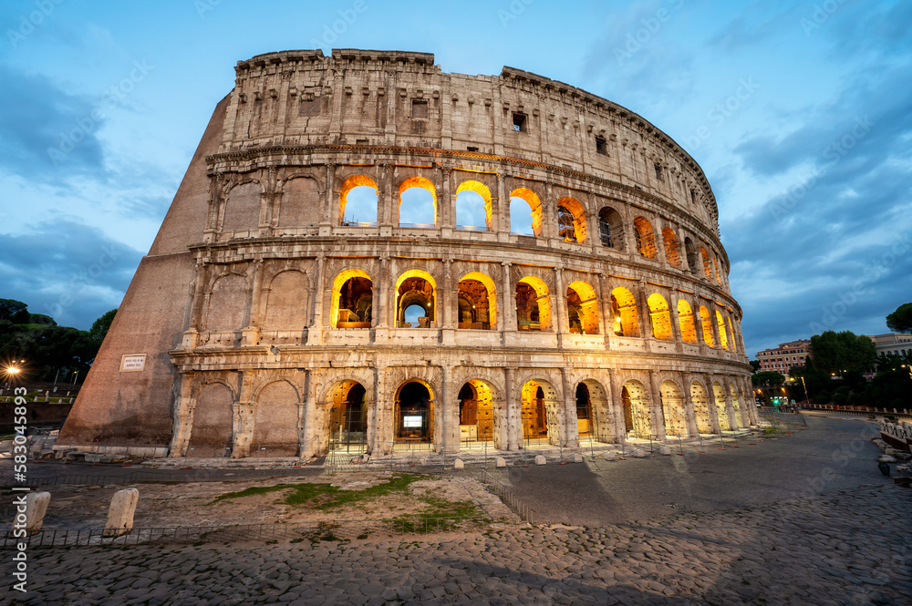 Amazing panoramic view of Colosseum in the blue hour before sunrise, Rome, Italy.