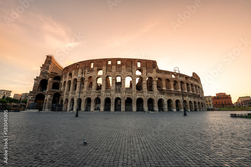 Photography Amazing view of the Colosseum at beautiful warm light at sunrise, Rome, Italy