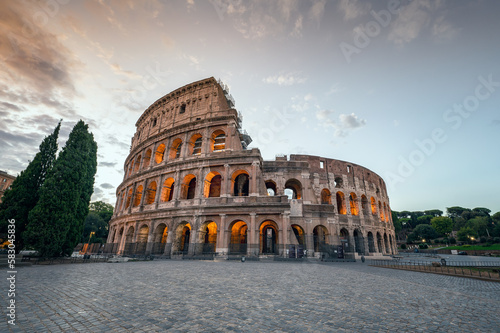 Amazing view of the Colosseum at beautiful warm light at sunrise, Rome, Italy..
