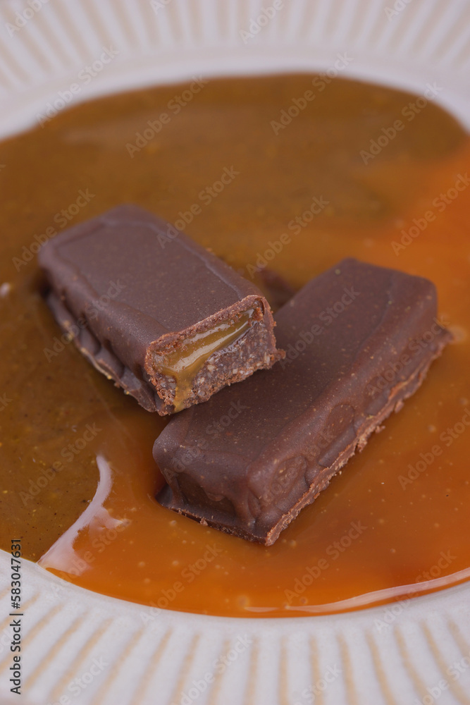 Sweet bar with caramel filling in caramel Sweet bar with caramel filling in caramel