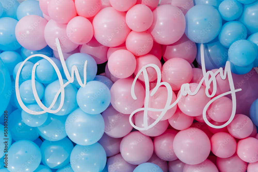 Photo zone, arch with pink and blue balloons for gender party. Boy or girl. Know gender of unborn child. Happiness of parenthood. Background, wall with text oh baby. Baby Shower party decor. Closeup. - obrazy, fototapety, plakaty 