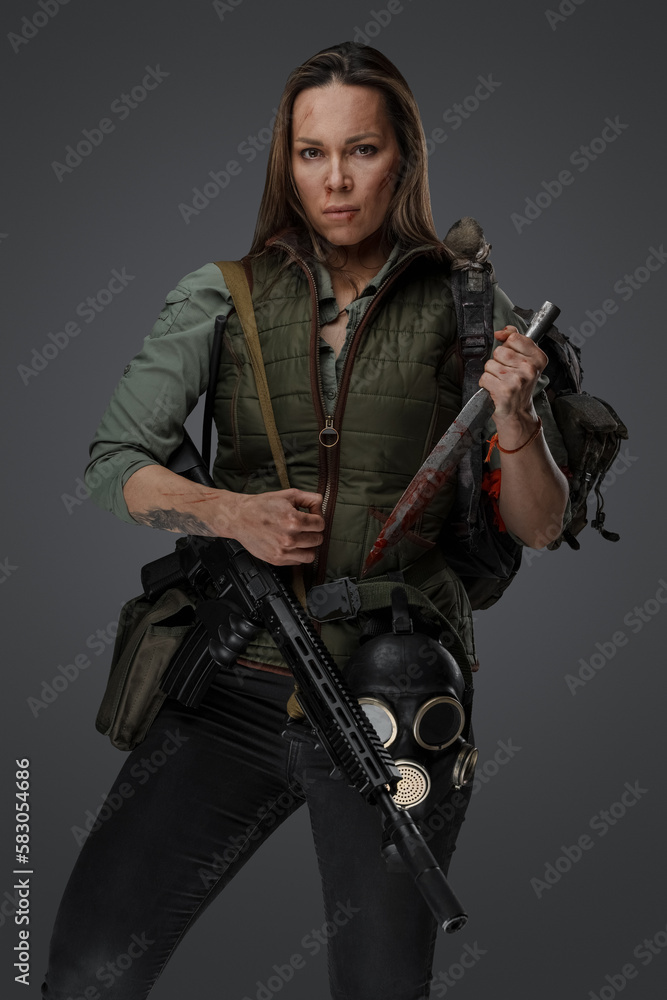 Shot of Mercenary woman in setting of post apocalypse looking at camera. Shot of Mercenary woman in setting of post apocalypse looking at camera.