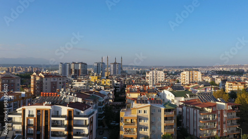 Aerial view of city landscape with high-rise buildings and streets. Metropolis on a summer day.