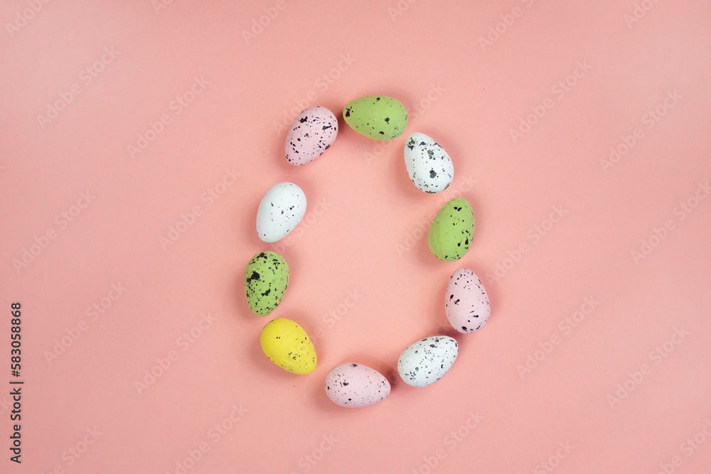 Decorative eggs on a pink background. Frame in the form of an Easter egg.