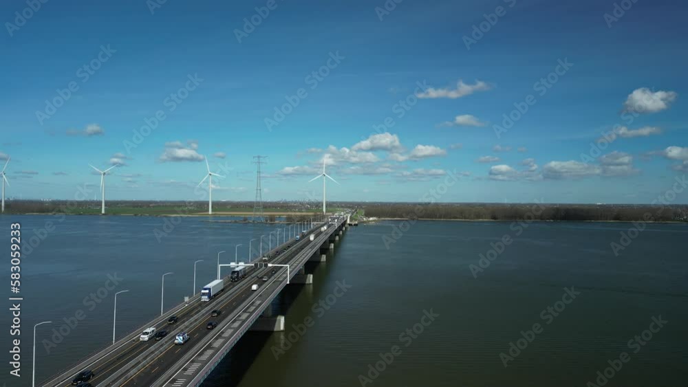 Drone flies next to and above a bridge with a national highway over a river Drone flies next to and above a bridge with a national highway over a river