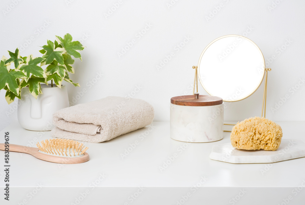 White table top in bathroom with bathing accessories and toiletries