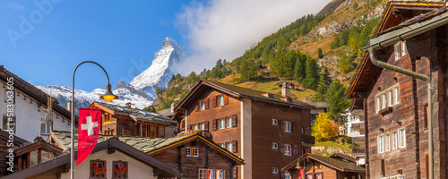 Matterhorn snow mount close-up and Zermatt alpine houses, Switzerland, Swiss Alps banner photo