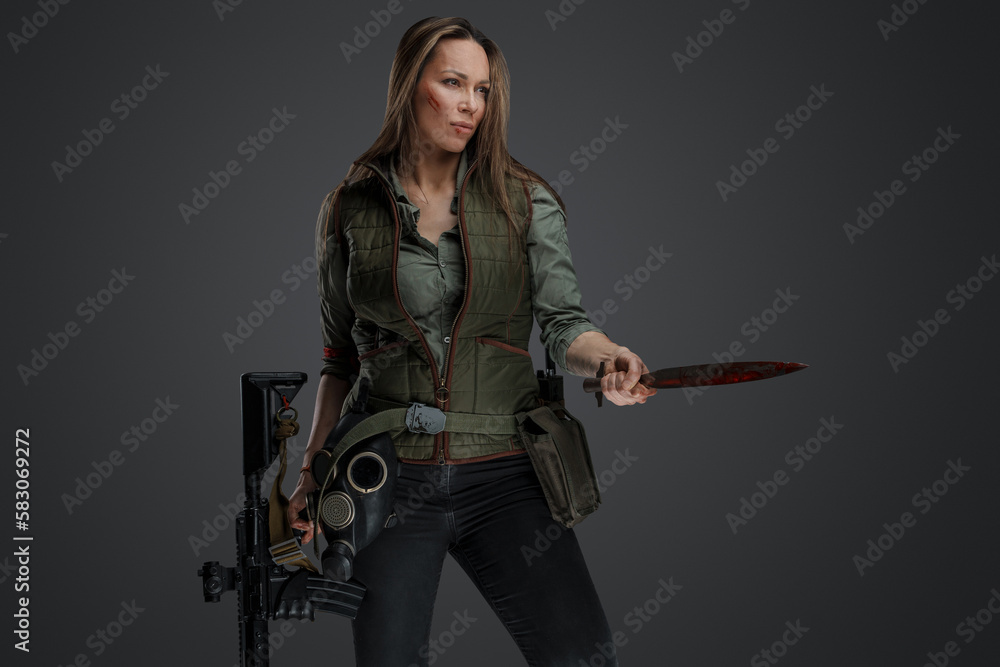 Studio shot of brown haired woman murderer in post apocalyptic setting. Studio shot of brown haired woman murderer in post apocalyptic setting.