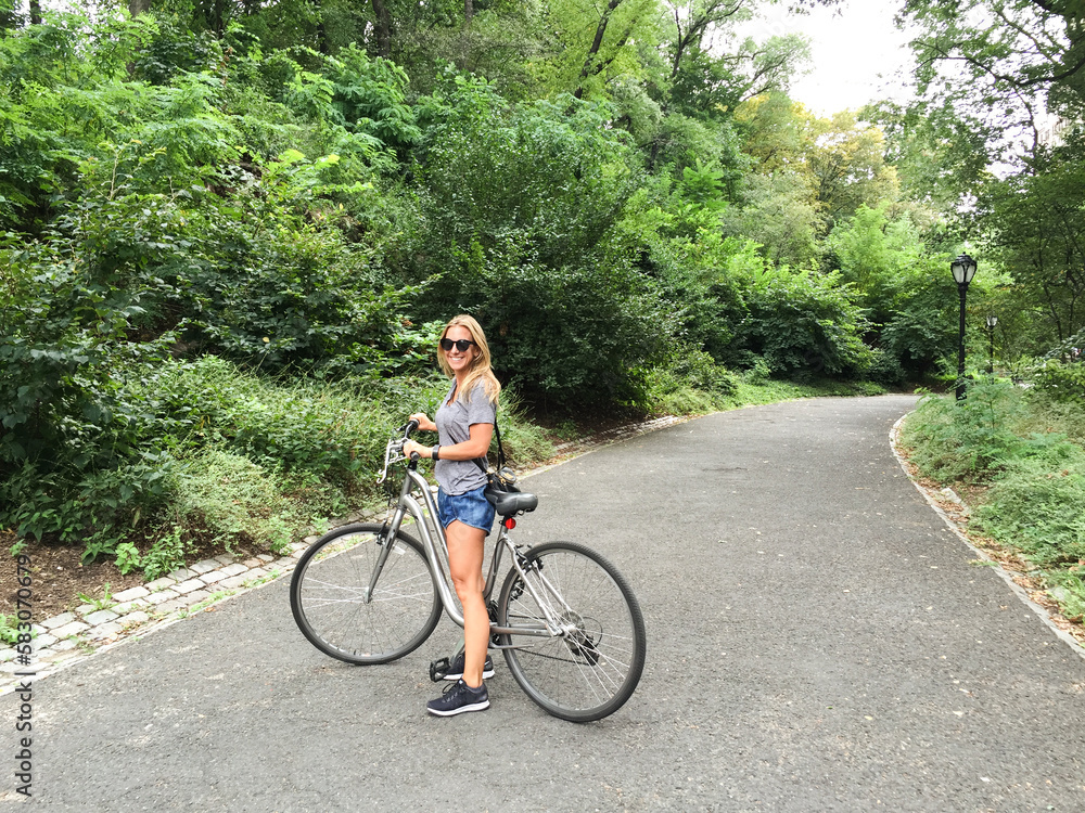 woman tourist riding a bike woman tourist riding a bike