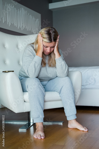 Bad news on mobile phone. Woman received a message from her therapist. 