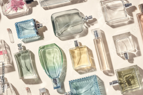 Slika na platnu This photo showcases a top-down view of numerous transparent glass perfume bottles, creating a visually appealing and elegant display