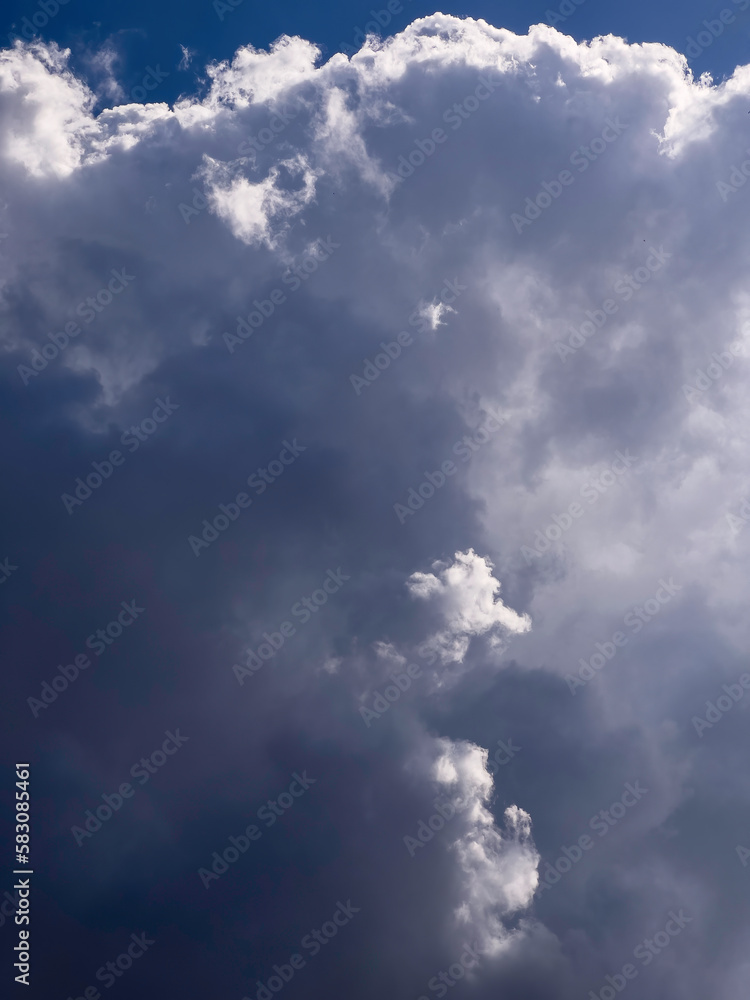 Obraz premium Momentary luminous prominence of portions of cloud early on an afternoon in spring, southwest Florida, for motifs of ephemeral phenomena, contrast, and illumination
