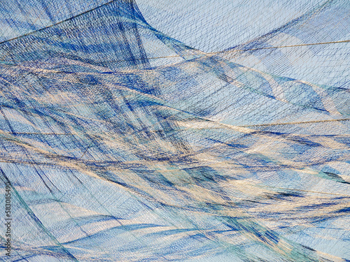 Wallpaper Mural Section of large blue and white netting suspended in mid air in a coastal public park, for background or element with marine, artistic, or dreamlike motif Torontodigital.ca