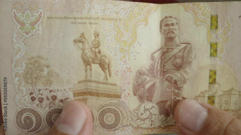 Select focus of a old version thousands Thai baht banknotes money. The baht is the official currency of Thailand. Select focus of a old version thousands Thai baht banknotes money. The baht is the official currency of Thailand.