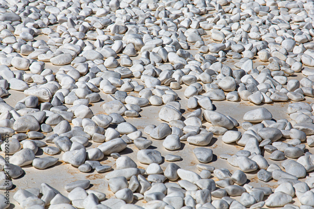 pebbles on the roof of a house in Santorini