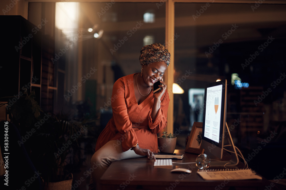 I just called to see if you can help me with something...a young businesswoman talking on a cellphone while using a computer in an office at night. I just called to see if you can help me with something...a young businesswoman talking on a cellphone while using a computer in an office at night.