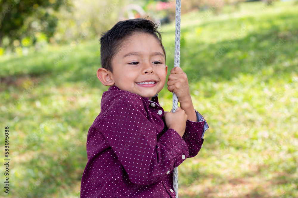 Colombian boy playing in the field with a big smile on his face. Colombian boy playing in the field with a big smile on his face.