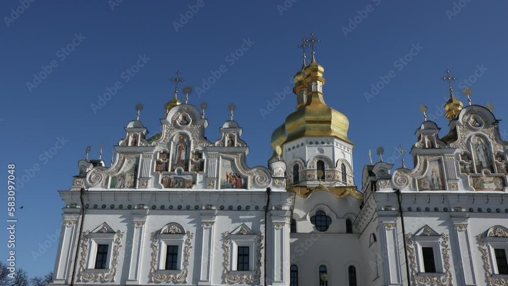 Beautiful view of the Assumption Cathedral of the Kiev-Pechersk Lavra. View of the cathedral from the outside. Beautiful golden domes and blue skies. Beautiful view of the Assumption Cathedral of the Kiev-Pechersk Lavra. View of the cathedral from the outside. Beautiful golden domes and blue skies.