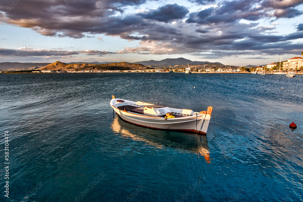 Fototapeta premium greek traditional fishing boat in the bay