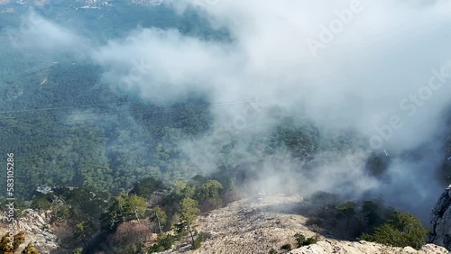 Aypetri clouds on the cliff photo