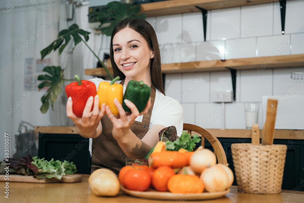 Woman preparing healthy food in her kitchen. Woman preparing healthy food in her kitchen.