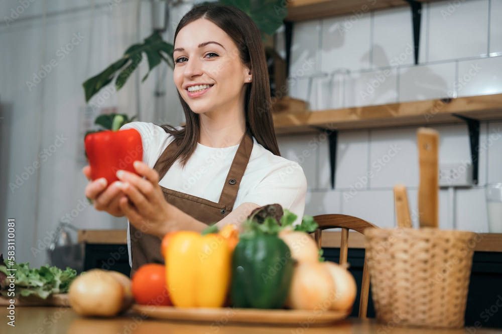 Woman preparing healthy food in her kitchen.