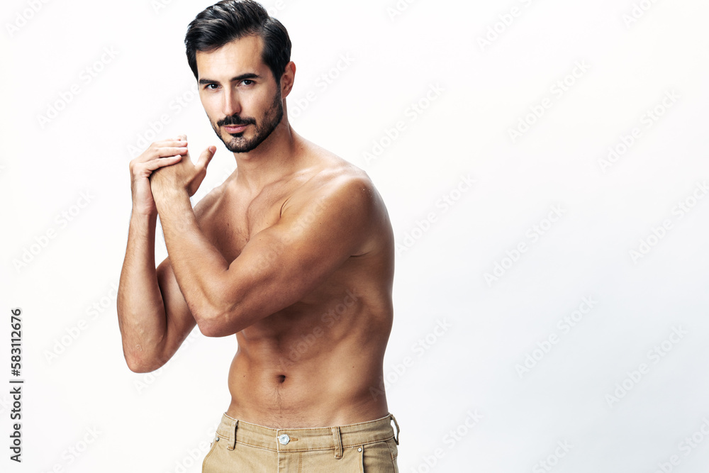 Fototapeta premium Male athlete model with naked torso and packs of abs sporty on white isolated background, trendy clothing style, copy space, space for text