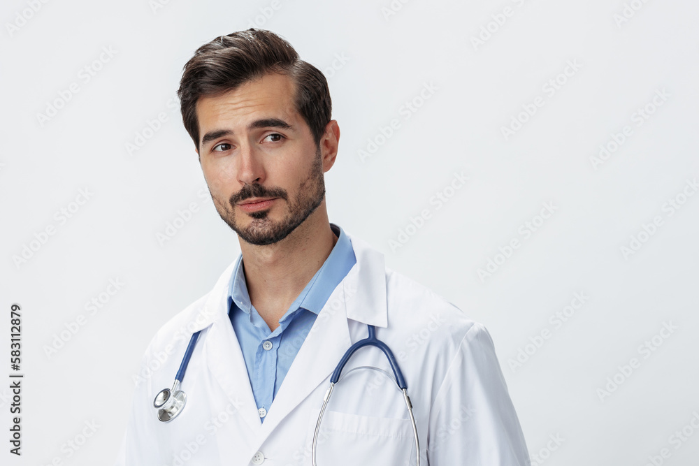 Man doctor in white coat with stethoscope and eyeglasses on white isolated background looking into camera, copy space, space for text, health Man doctor in white coat with stethoscope and eyeglasses on white isolated background looking into camera, copy space, space for text, health