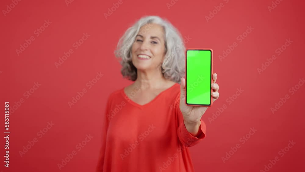 Chroma screen of the mobile held by a woman Chroma screen of the mobile held by a woman