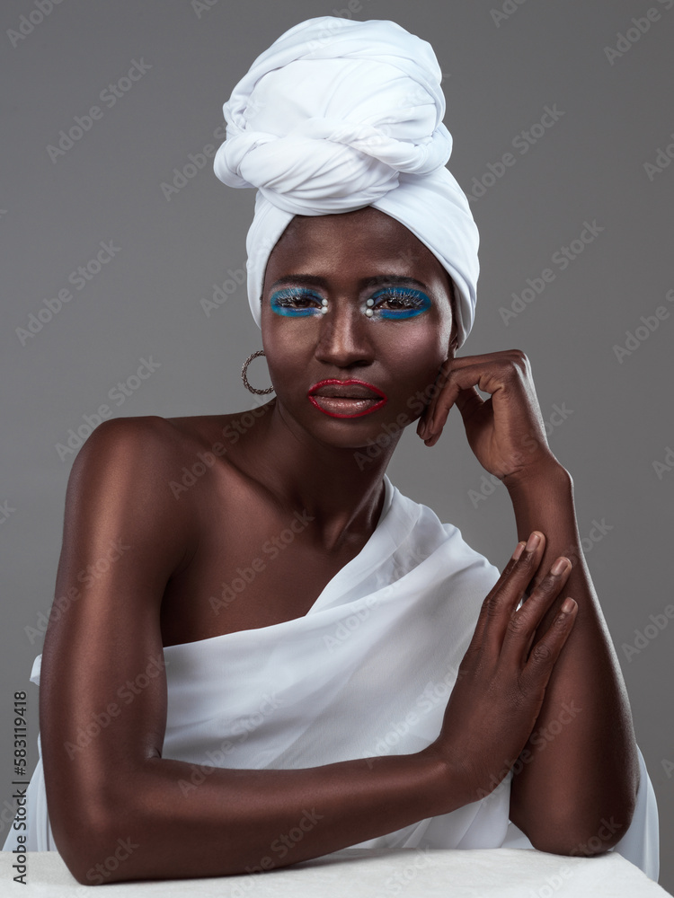 Accessories are the exclamation point of a woman. Studio portrait of an attractive young woman posing in traditional African attire against a grey background. Accessories are the exclamation point of a woman. Studio portrait of an attractive young woman posing in traditional African attire against a grey background.