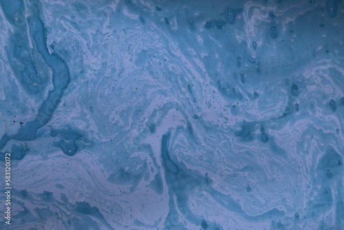 Close up of original beautiful unique marble pattern paper for interior of book cover, abstract design blue colour tones created ancient texture oil paint and turps technique of  mix swirl on water fl