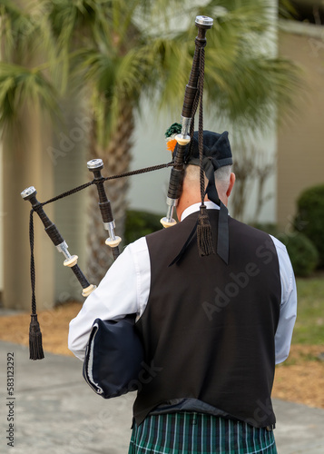 Bagpipes being played by an older gentleman
