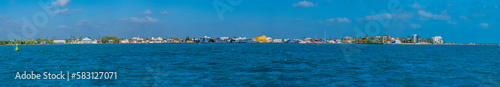 A panorama view approaching Belize City, Belize from the sea on a sunny day