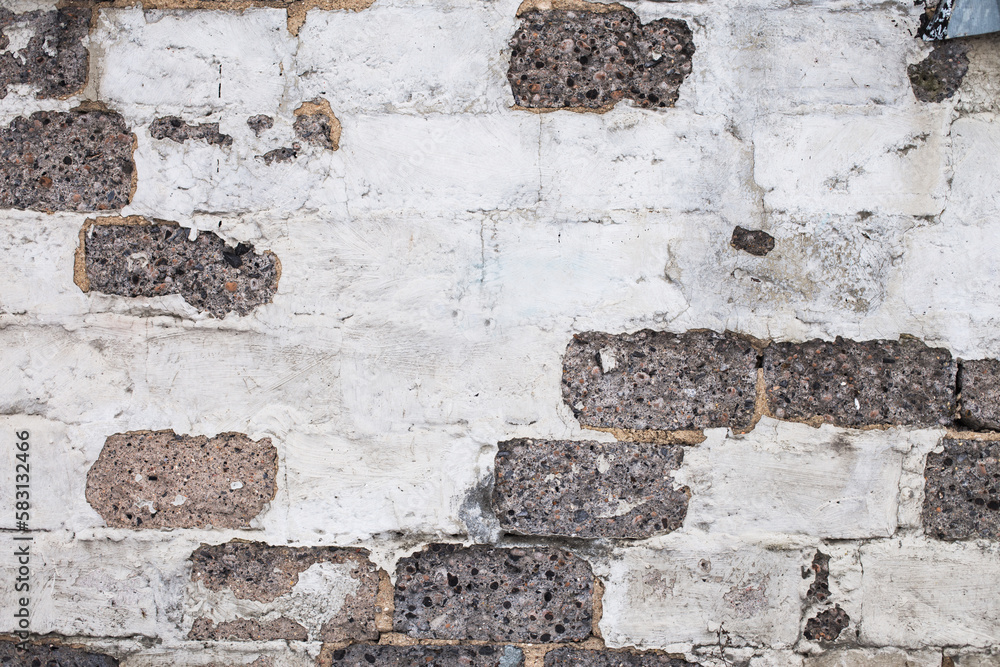 Fototapeta premium Old brick white gray color wall background. Light stone texture
